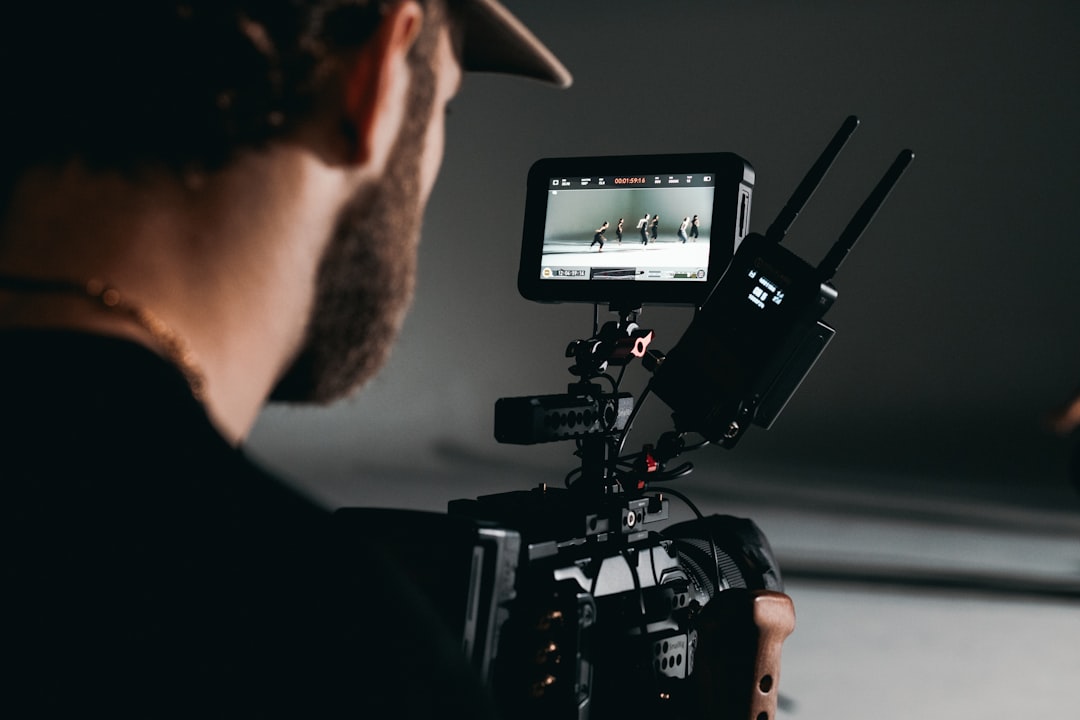 man-in-black-shirt-holding-video-camera-i-nd-lscy04